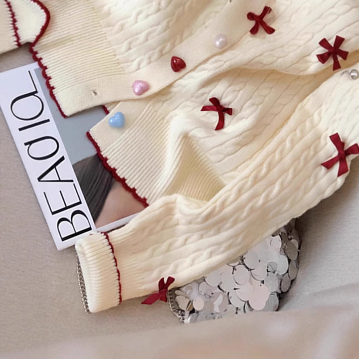 Knitted jacket for women with a playful cable pattern and colorful button details Lune London