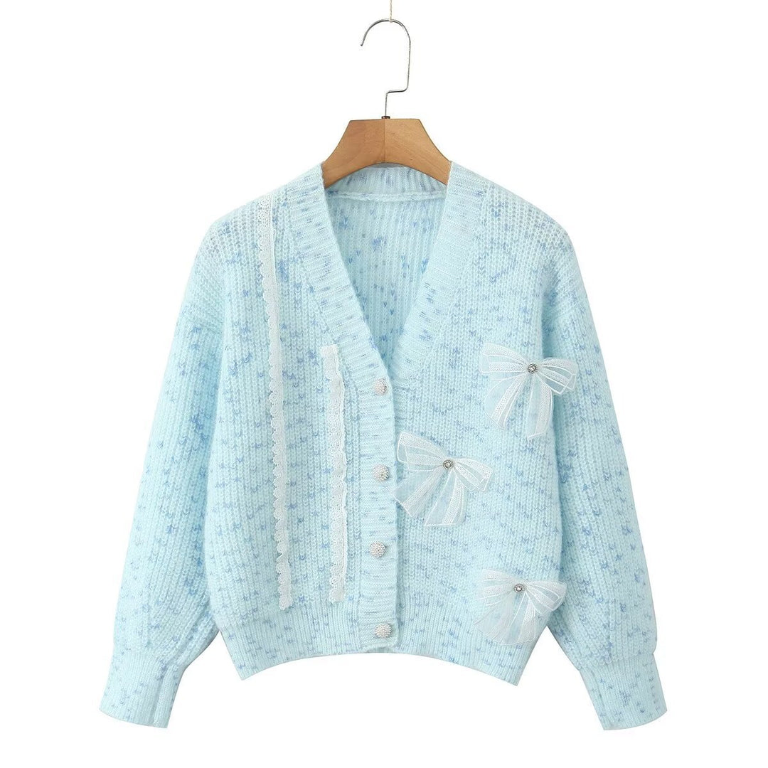 Women's knitted jacket with decorative knots and a delicate pattern Lune London