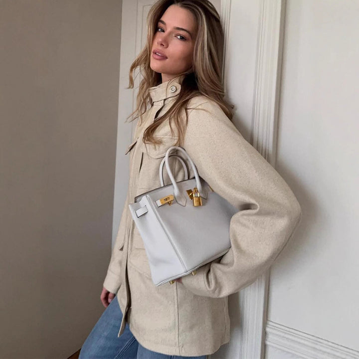 Women's oversized field jacket made of wool blend with stand-up collar and applied flap pockets