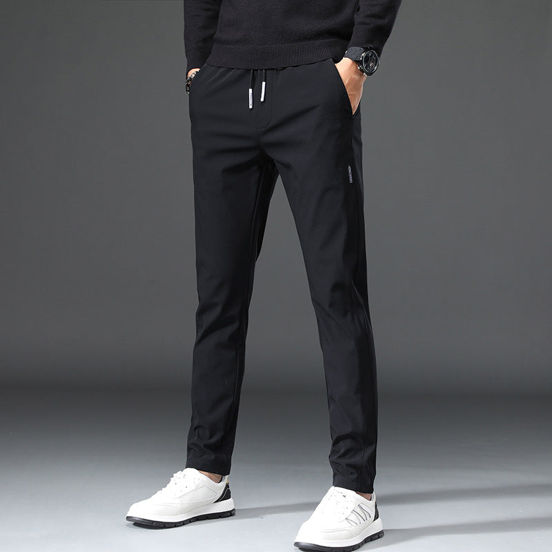 Men's slim fit sports pants with elastic waistband and practical zip pockets Lune London