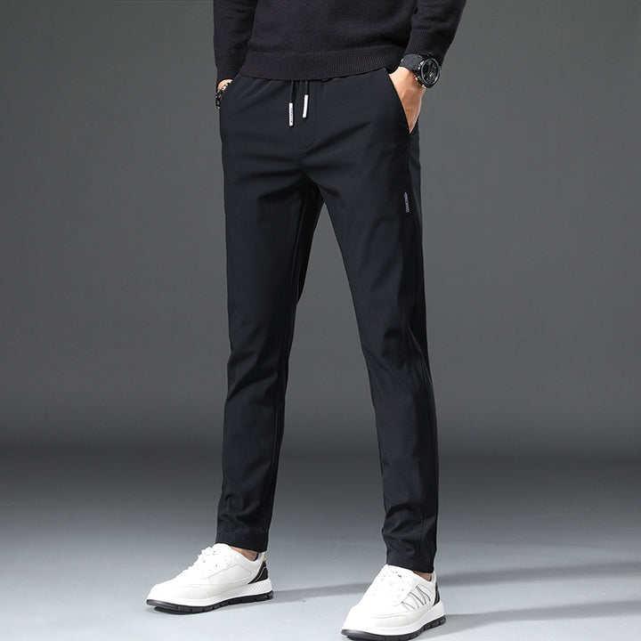 Men's slim fit sports pants with elastic waistband and practical zip pockets Lune London
