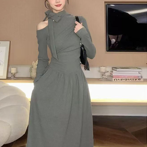 Women's dress with asymmetric neckline and elegant bow design