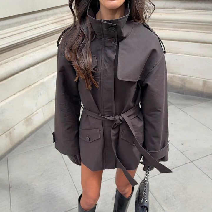 Women's Short Tailored Trench Jacket with Stand-Up Collar, Flap Pockets and Tie Belt Amarae
