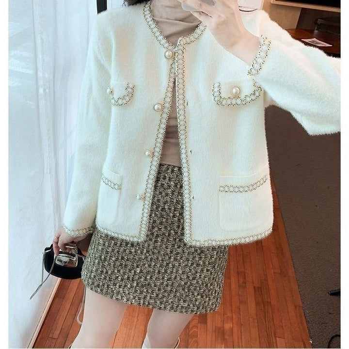 Veste bouclée élégante pour femmes avec garniture en perles Chic & Stil