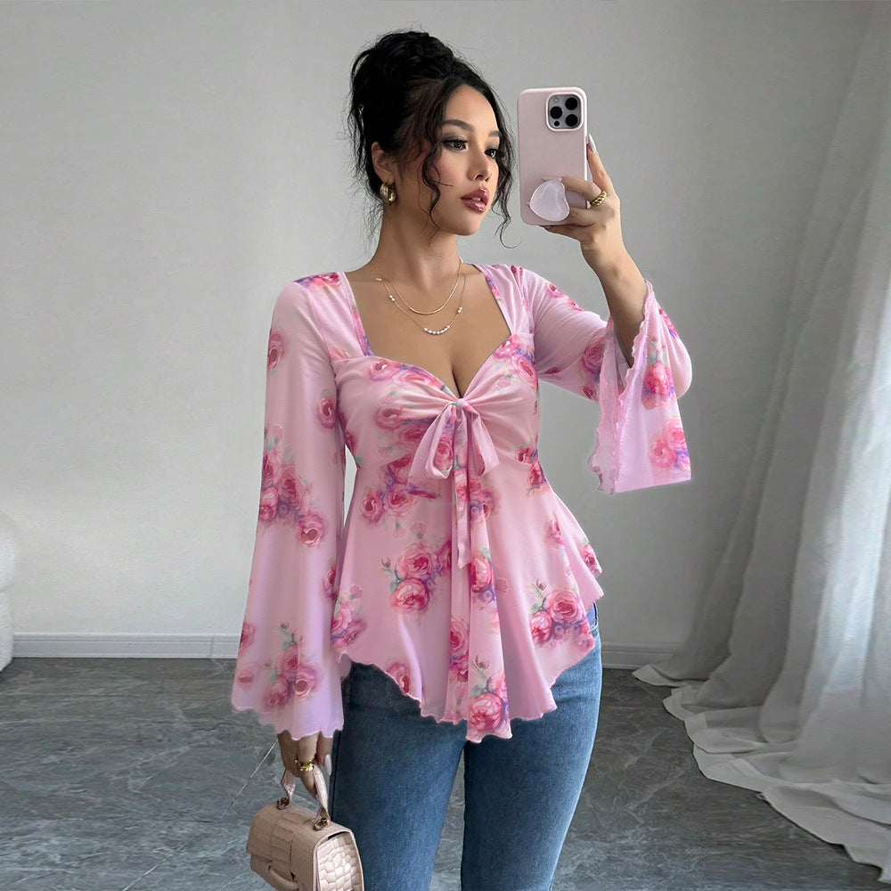 Blouse fluide pour femmes avec motif floral et nœud ludique Chic & Stil