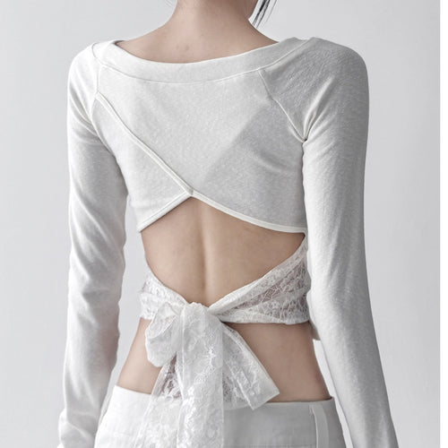 Women's casual long sleeve top with open back and decorative tie belt Chic & Stil