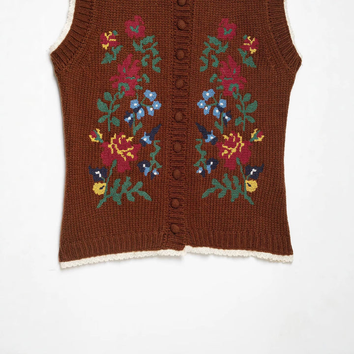 Women's sleeveless knitted vest with floral intarsias, button placket and crocheted hem Amarae
