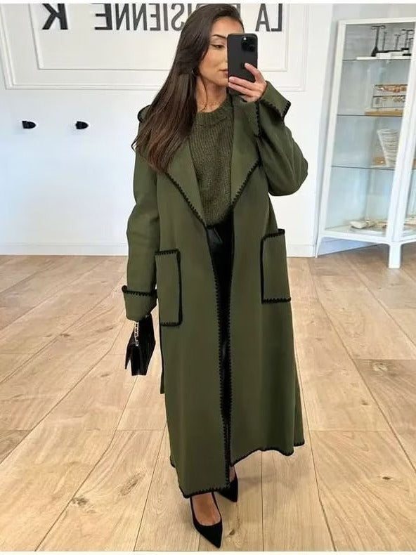 Elegant long coat for women with a tie belt and contrasting piping Lune London