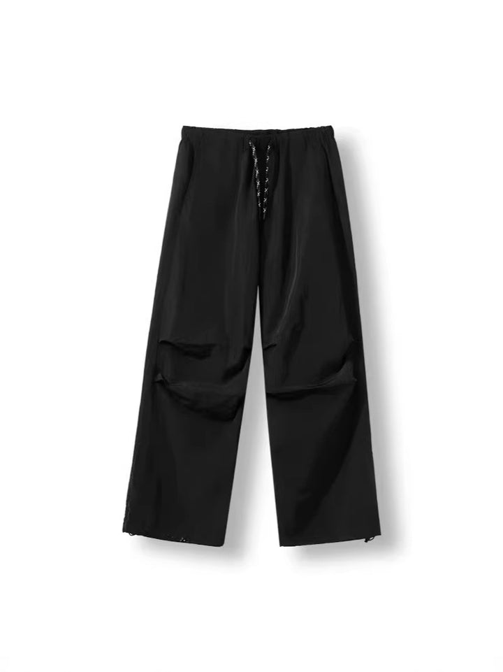 Men's loose-fitting nylon track pants with drawstring, patch pockets, and straight wide-leg fit Amarae
