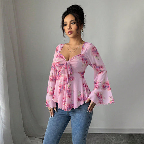 Blouse fluide pour femmes avec motif floral et nœud ludique Chic & Stil