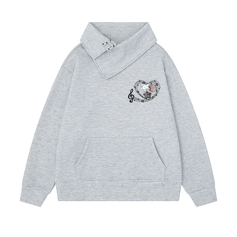Women’s oversized sweatshirt with asymmetrical stand-up collar, kangaroo pocket and musical heart embroidery Amarae