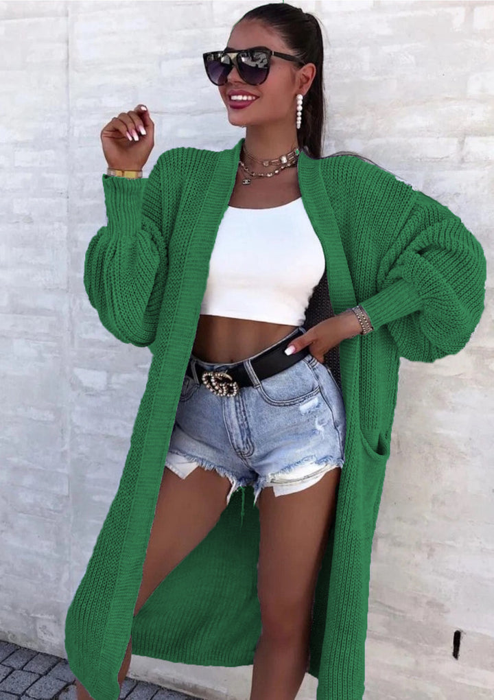 Long knitted coat for women with oversized sleeves and practical pockets Lune London