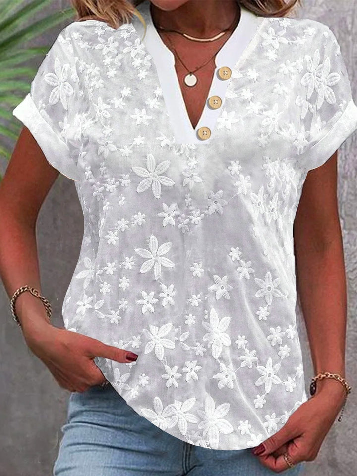 Women’s blouse with embroidered floral pattern and classic V-neck Lune London