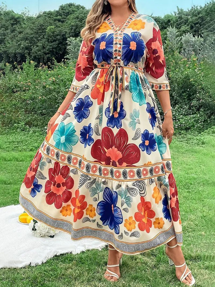 Women's maxi dress with colorful floral design and waist belt Lune London