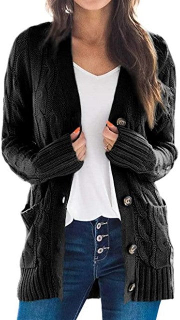 Knitted women's pullover with a structured cable pattern and practical pockets Lune London