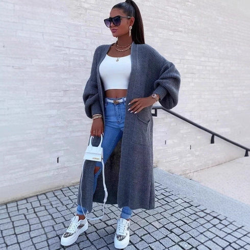 Long knitted coat for women with oversized sleeves and practical pockets Lune London