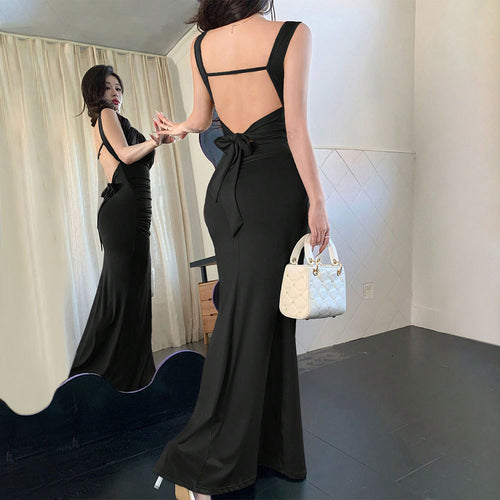 Elegant evening dress for women with refined back cutouts and decorative tie belt Chic & Stil