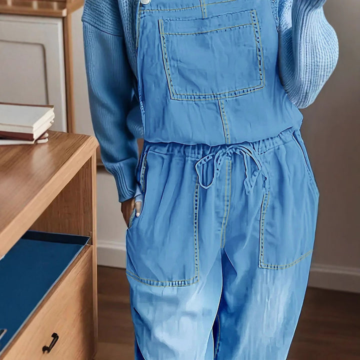 Women's overall jumpsuit made of lightweight denim with a drawstring waistband, patch pockets, and turned-up hem Amarae