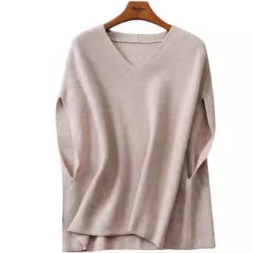 Knitted poncho for women with V-neck and chic elegant silhouette