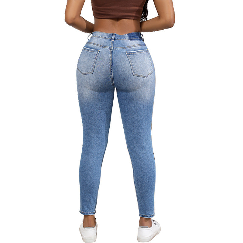 High-waisted women’s jeans with a trendy ripped look featuring strong tear details Lune London