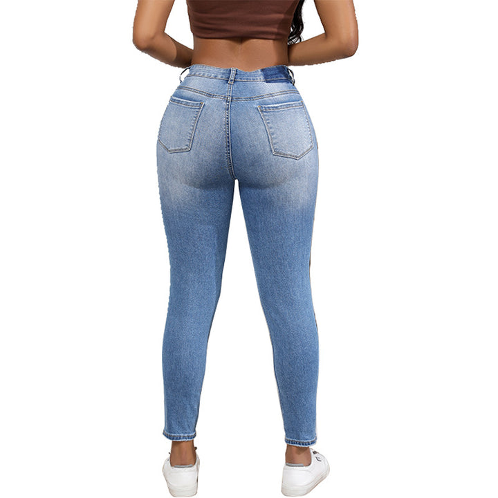 High-waisted women’s jeans with a trendy ripped look featuring strong tear details Lune London