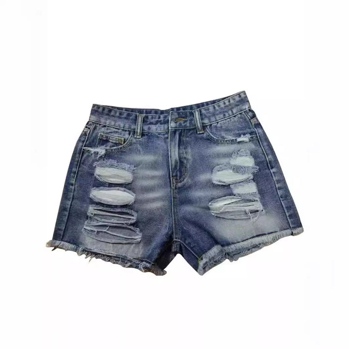 Ladies trendy destroyed denim shorts with frayed hems and fashionable ripped details Lune London