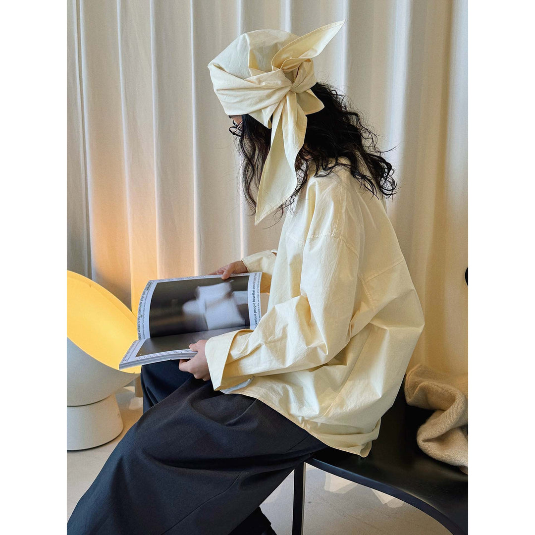 Women loosely cut cotton blouse with wrapped shawl collar and wide cuffs