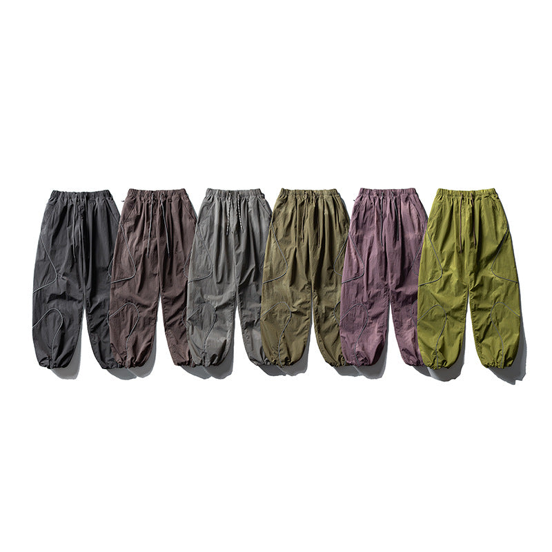 Men's loose utility harem pants made of ripstop with drawstring waistband, shaped panels, and elastic ankle cuffs Amarae