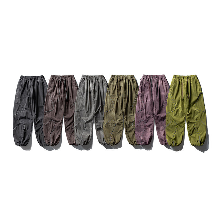 Men's loose utility harem pants made of ripstop with drawstring waistband, shaped panels, and elastic ankle cuffs Amarae