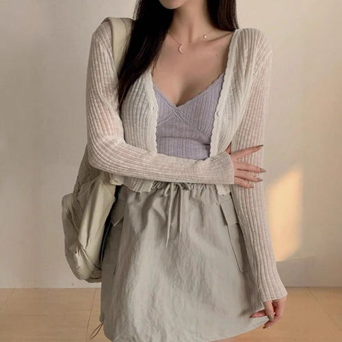 Womens playful cardigan with decorative details and a lightweight fabric Amarae