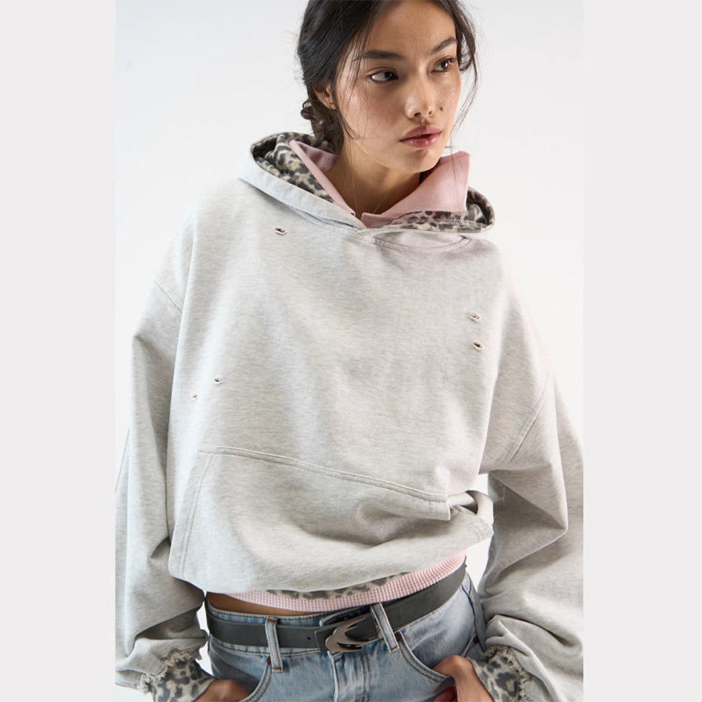 Women’s cropped oversized hoodie with leopard inner lining, used details and kangaroo pocket Amarae