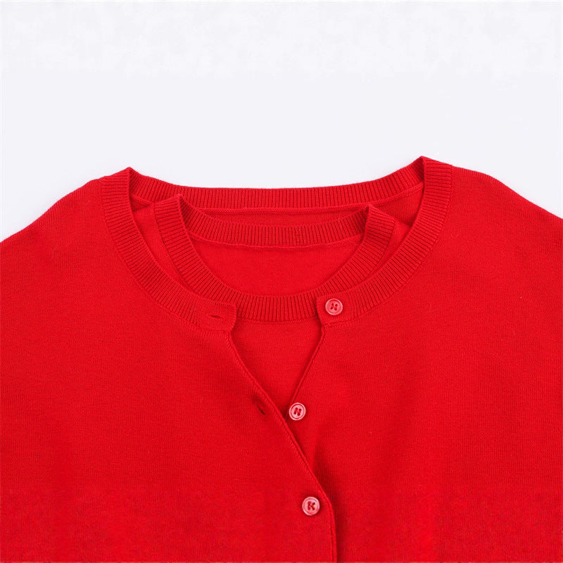 Short knitted sweater for women with button detail and V-neck Lune London