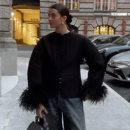 Fashion quilted jacket for women with a refined tied belt and elegant fox fur sleeves Amarae