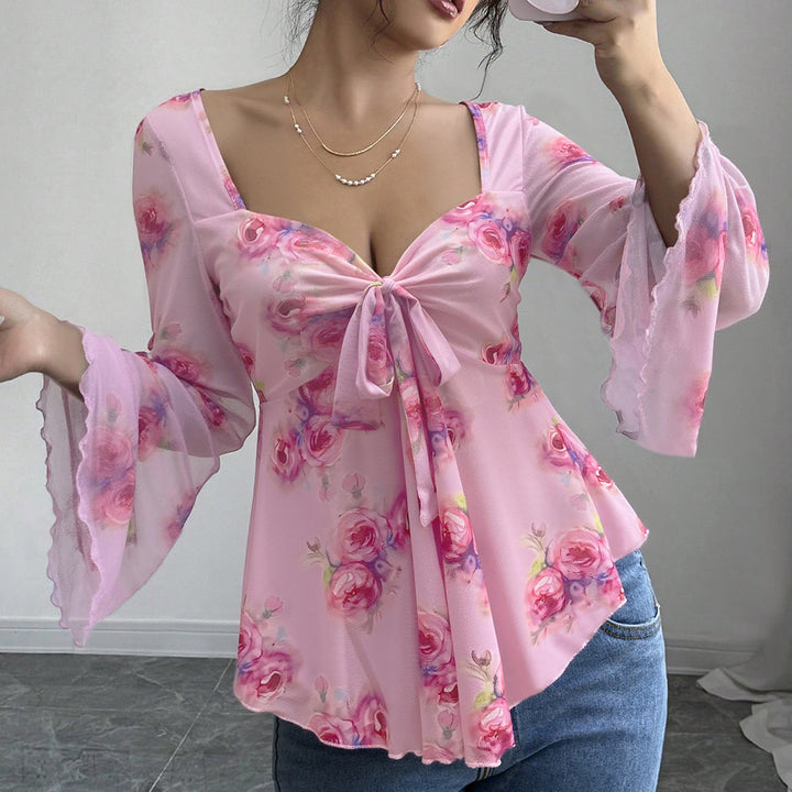 Blouse fluide pour femmes avec motif floral et nœud ludique Chic & Stil