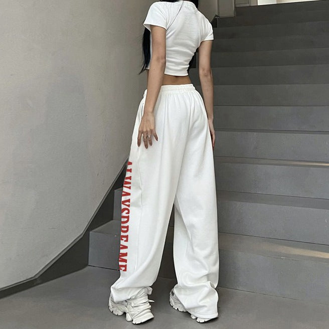 Women’s casual sweatpants with motivational lettering and elastic waistband Chic & Stil