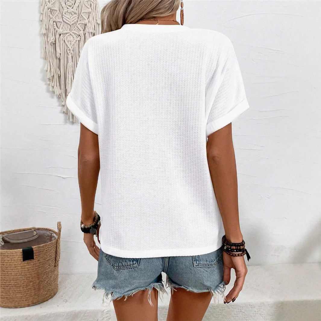 Casual short sleeve t-shirt for women with a decorative button placket design and a chic honeycomb texture