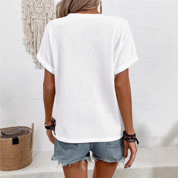 Casual short sleeve t-shirt for women with a decorative button placket design and a chic honeycomb texture