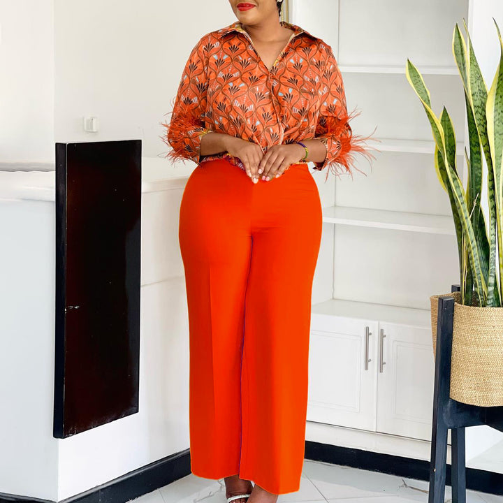 Expressive outfit for women with printed blouse and wide pants Lune London