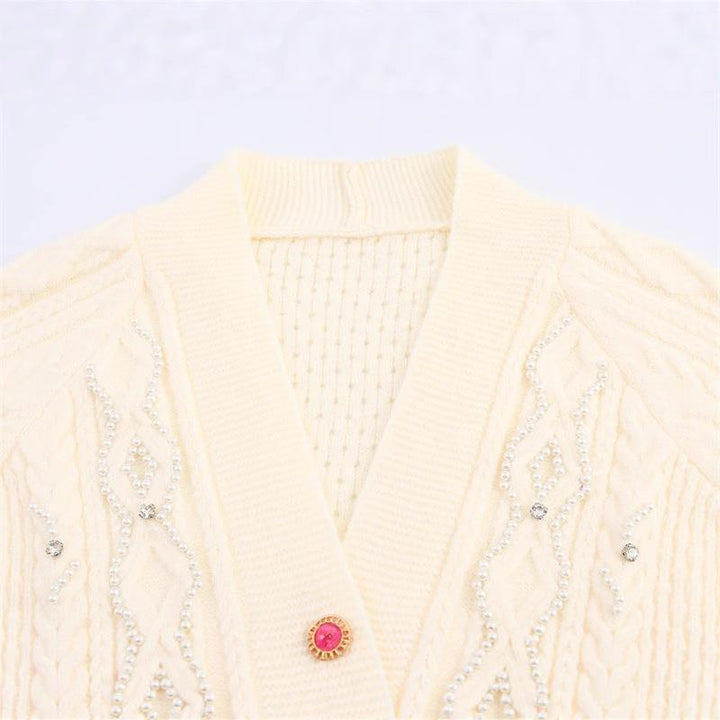 Knitted jacket for women with a detailed textured pattern and elegant ruffle details Lune London