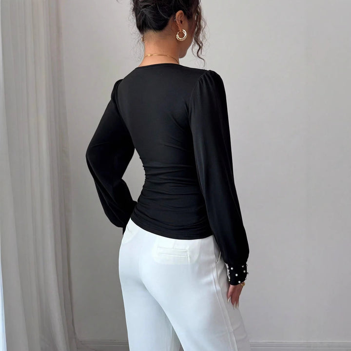 Chemisier élégant pour femmes avec décolleté en V et décoration Chic & Stil
