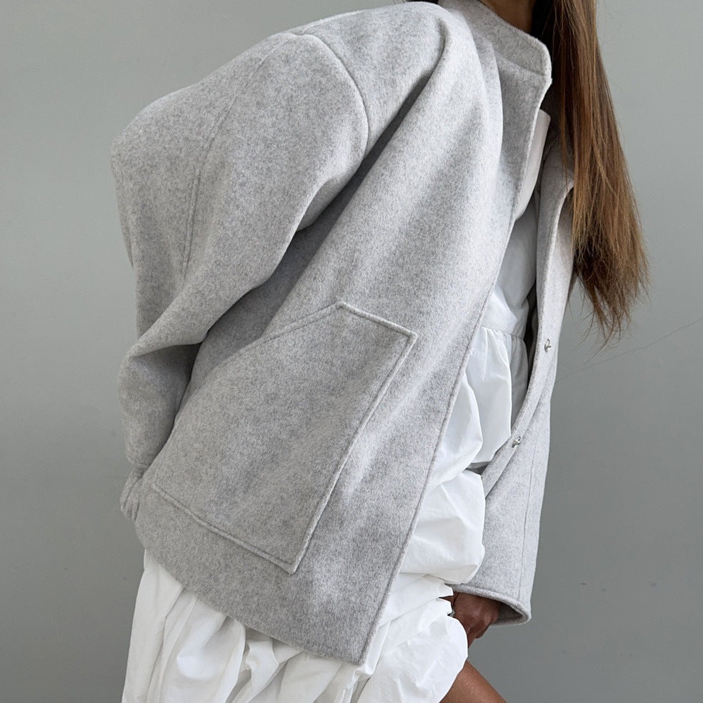 Oversized wool coat for women with simple button details and practical pockets Lune London