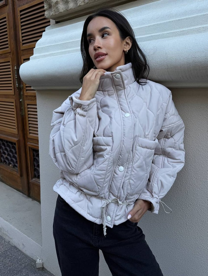 Quilted transitional jacket for women with high collar and drawstring Lune London