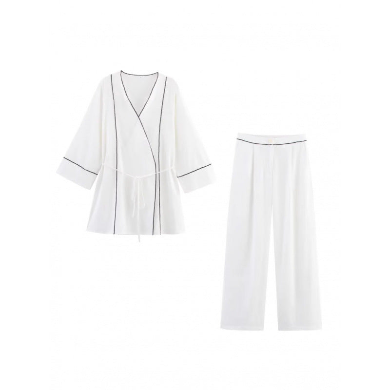 Wide-leg high-waisted women's trousers with elegant belt ornament Lune London