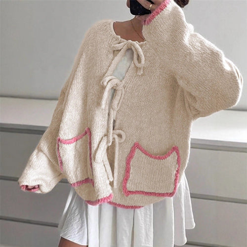 Ladies casual knit jacket with a unique tie detail and large pockets Amarae