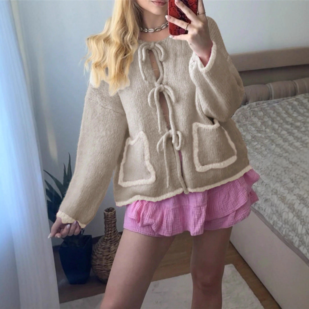 Ladies casual knit jacket with a unique tie detail and large pockets Lune London