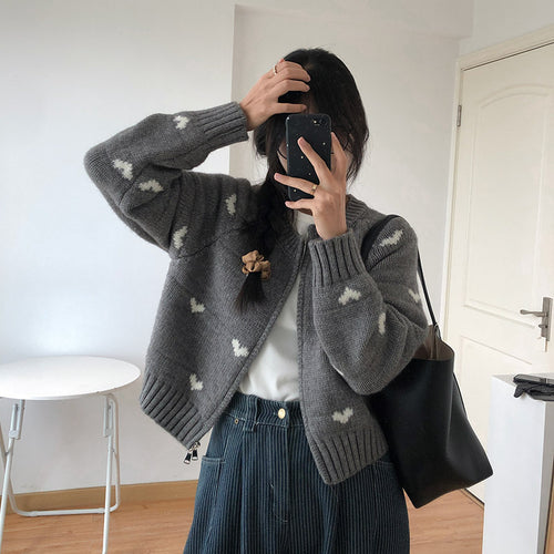 Ladies comfortable cardigan with heart pattern and chic style elegant button detail