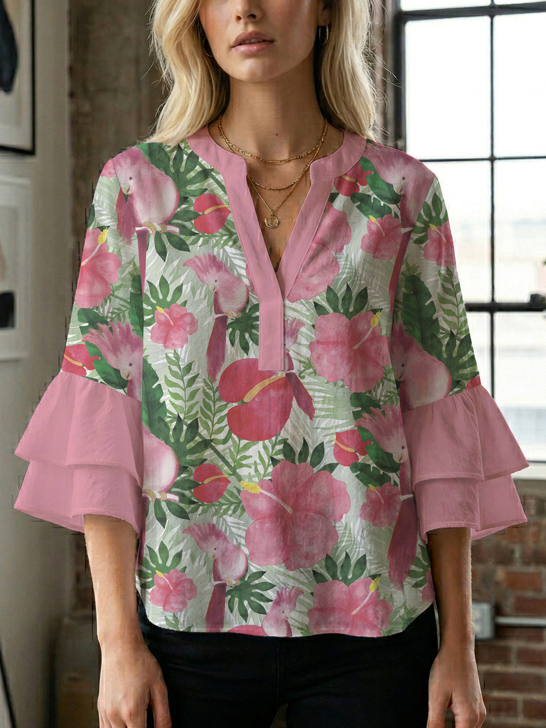 Women’s blouse with voluminous ruffled sleeves and floral pattern Lune London