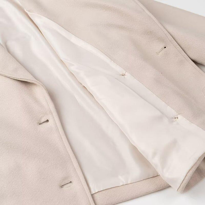 Elegant wool coat for women with double-breasted closure and modern details Lune London