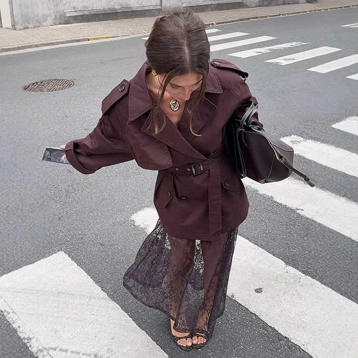 Women's short trench coat with oversized cut, waist belt and prominent shoulder patches Amarae