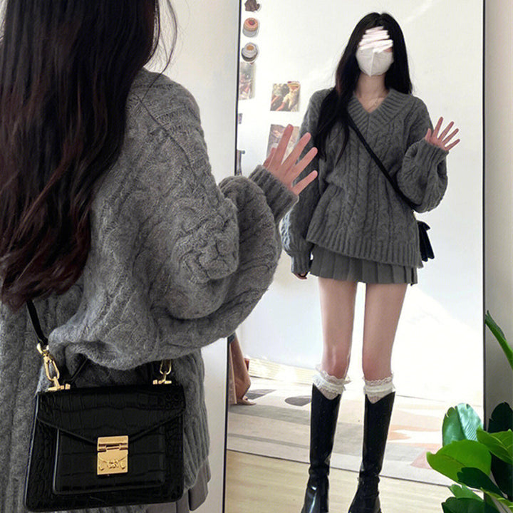 Pull en tricot épais pour femmes avec col en V et manches volumineuses Chic & Stil